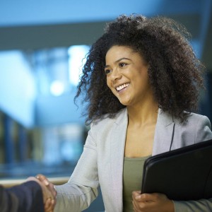 smiling woman shaking hands